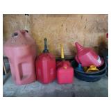Under table contents: plastic gas jugs, oil
