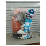 Large bag of stuffed animals pillows pig in a