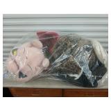 Sorted stuffed animals and bedding and who r