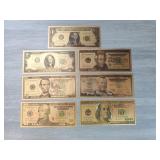 Seven piece 24 karat gold bill set