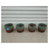Four new four and a half inch ceramic planters
