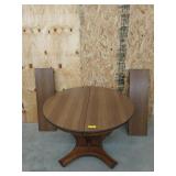 Beautiful round table 29x42 with two 12-in l