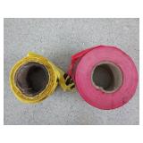 Partial rolls of danger and caution tape