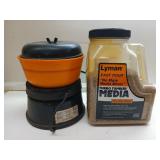 Lyman tumbler, media