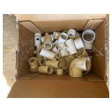 Box of new PVC fittings