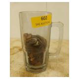 Beer glass with undetermined amount of coins