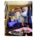 Two boxes of notepads, tins, bowls, silverware,