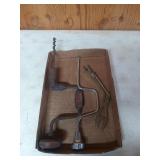 Two hand crank saws and one manhole cover key