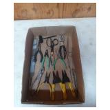 Assorted tools, snips, strippers, and pliers