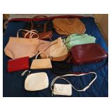 Plastic tub full of assorted ladies purses and