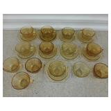 Yellow glass: 9 ct 5.75" saucers, 14 teacups;