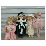4 asst porcelain dolls