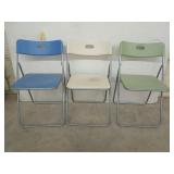 3 metal framed plastic folding chairs