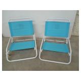2 folding beach chairs