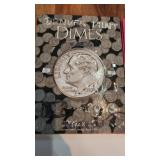 dimes collectors binder with various voins as