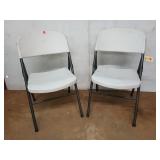 2 Mainstays plastic folding chairs