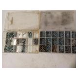Plastic organizers full of assorted hardware