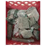 Plastic crate of petrified wood