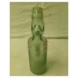 Glass bottle w/ marble molded in neck