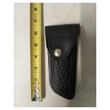 Hibben pro-folder knife by Gil Hibben in leather