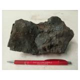 Heavy black rock, perhaps from space 4x6.5x4