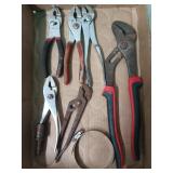 Channel locks, assorted pliers, large hose clamp