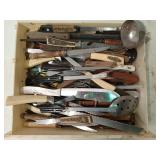 Large assortment of kitchen utensils, knives