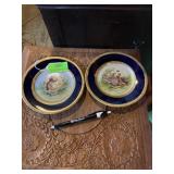 Small gold rimmed decorative plates  artist