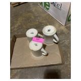 Three assorted coffee mugs