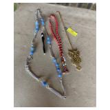 Three. Assorted necklaces.