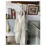 Very nice dress form with white wedding gown and