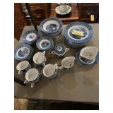 Currier and Ives eight piece place setting .