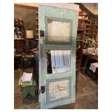 Solid wood paneled door with vintage hardware