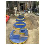 Large blue and yellow metal letters. 36 inches