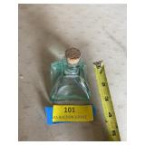 Vintage aqua glass bottle with cork stopper