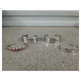 Four cuff-style bracelets