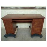 Three drawer desk 29 by 59 and a half by 23 and a