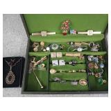 Jewelry box of assorted earrings, pins,