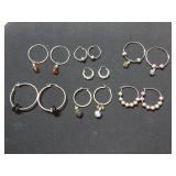 Seven pair of costume hoop earrings