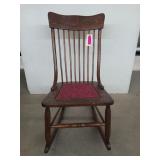 Old wooden rocker w/ upholstered seat