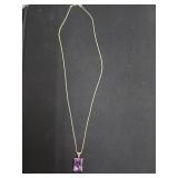 14 karat gold necklace with purple stone and 18