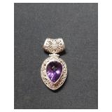 2 inch Silver pendant with purple gem