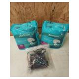 Two new packs of 2XL unisex adult diapers, and a