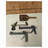 Two caulk guns, one 6.5in quick grip bar clamp and