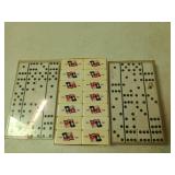 3 sets of dominoes in small plastic crate