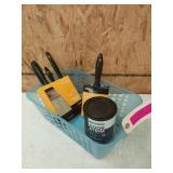 Painting supplies in blue tub