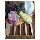 A multitude of blankets, quilts, linens, and