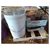 Four boxes and one bucket full of mason jars for