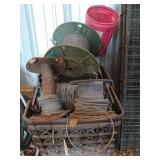 Brown milk crate full of wiring/wire fencing
