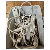 Box of power strips, extension cords, heating pad